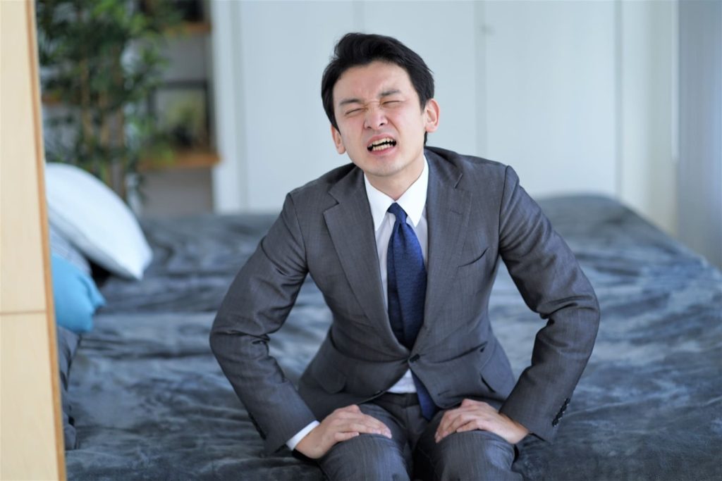 仕事に行きたくない男性